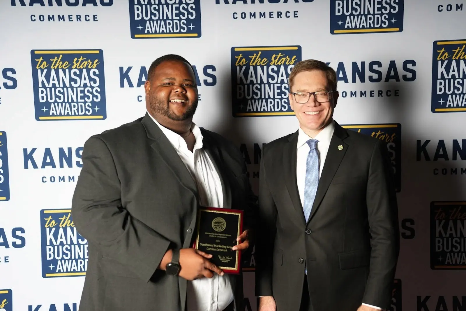 Damien Denmark receiving an award